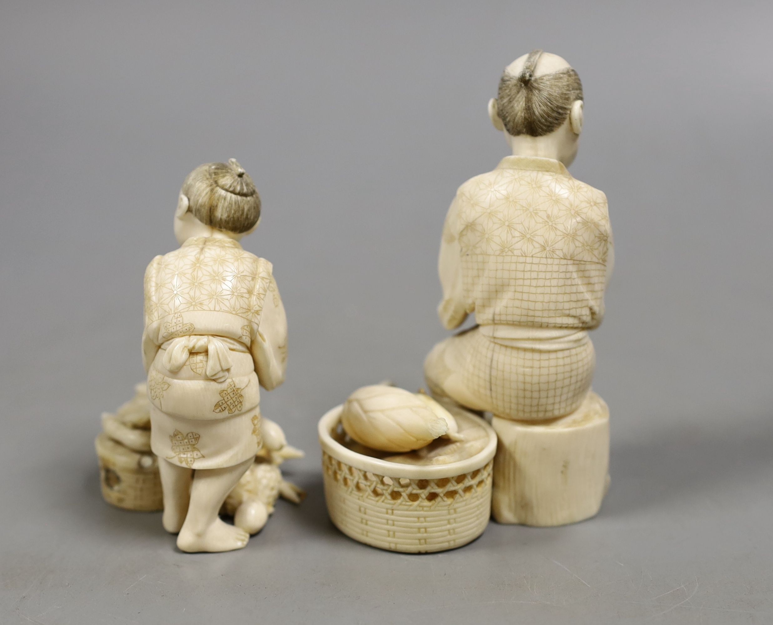 A Japanese ivory group of a farmer and boy, early 20th century, farmer 11.5 cms high.